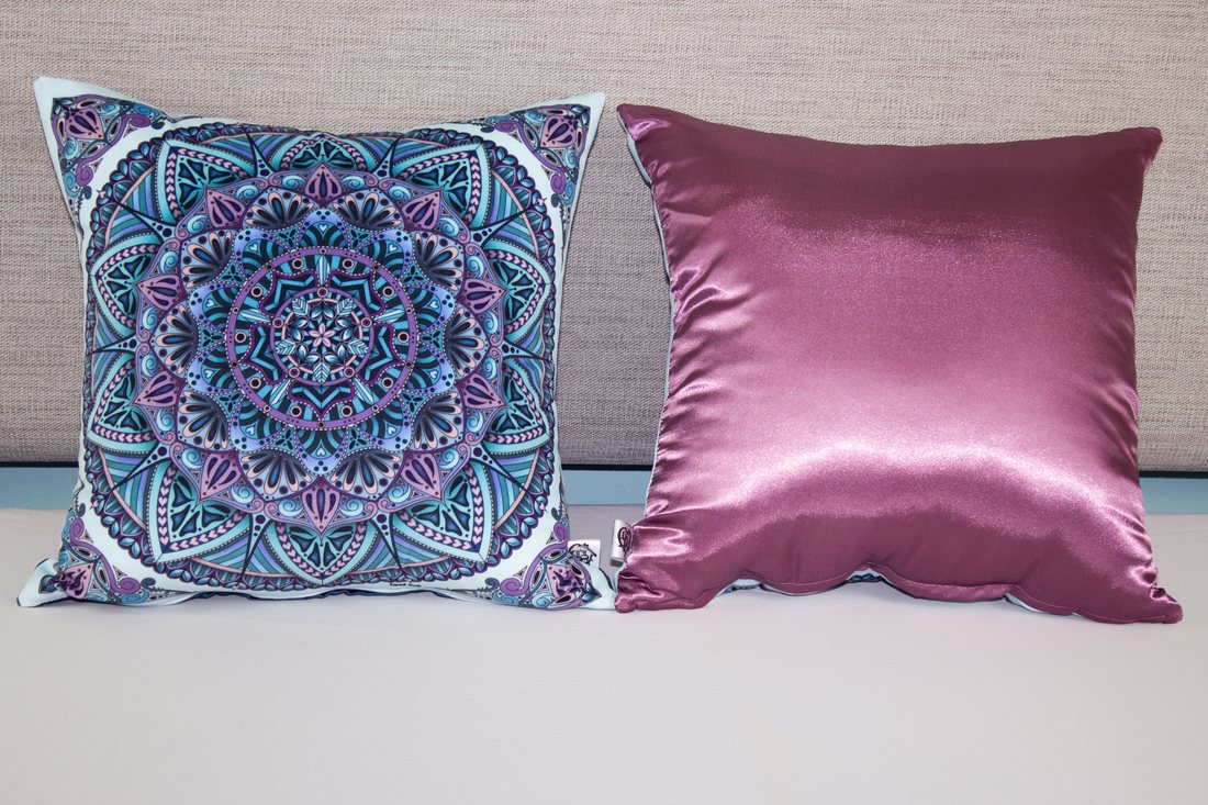 Hearty Mandala velvet cushion beside a plain satin cushion