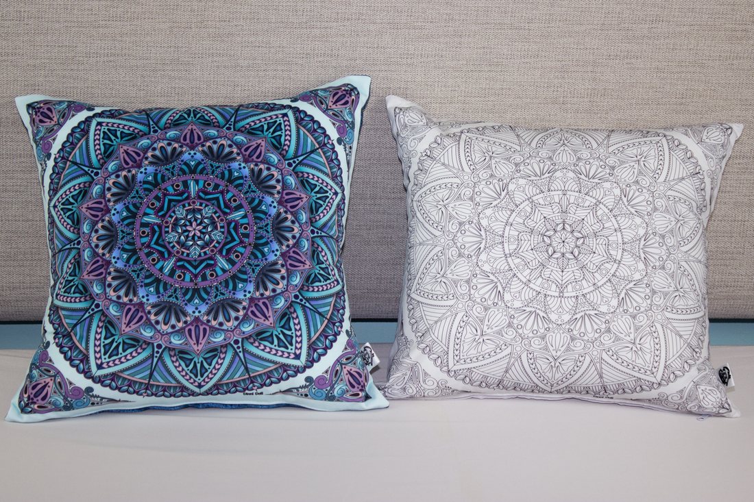 Hearty Mandala outline cushion cover beside the colour version